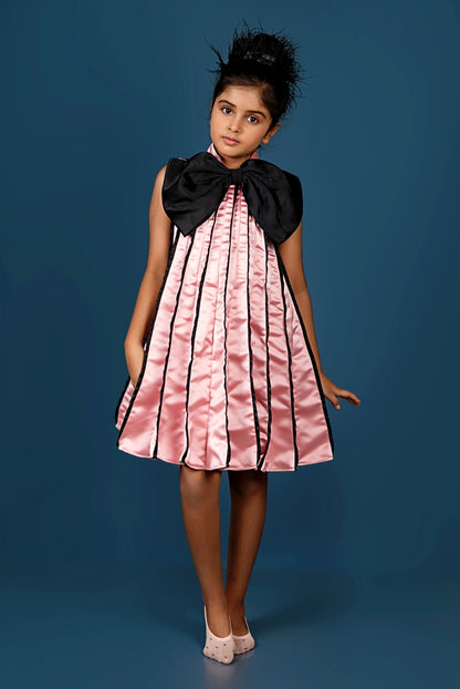 Subtle Pink Meets Black Bow in This Chic Pleated Dress