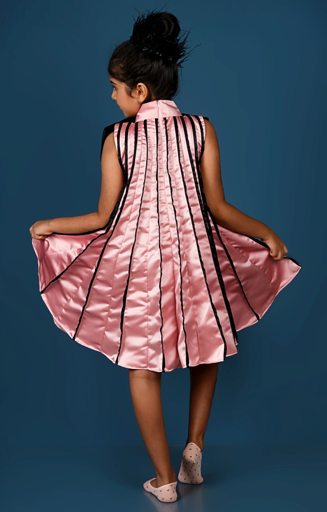 Subtle Pink Meets Black Bow in This Chic Pleated Dress